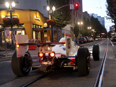 race car racing through the street
